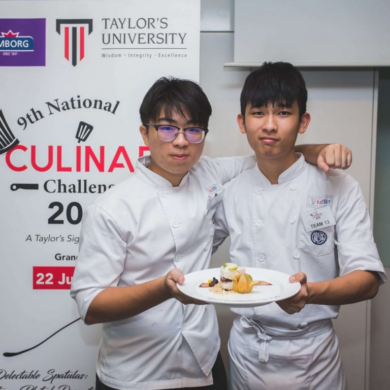 Two young chefs showcase a dish during the Taylor's University National Culinary Challenge 2019 event.